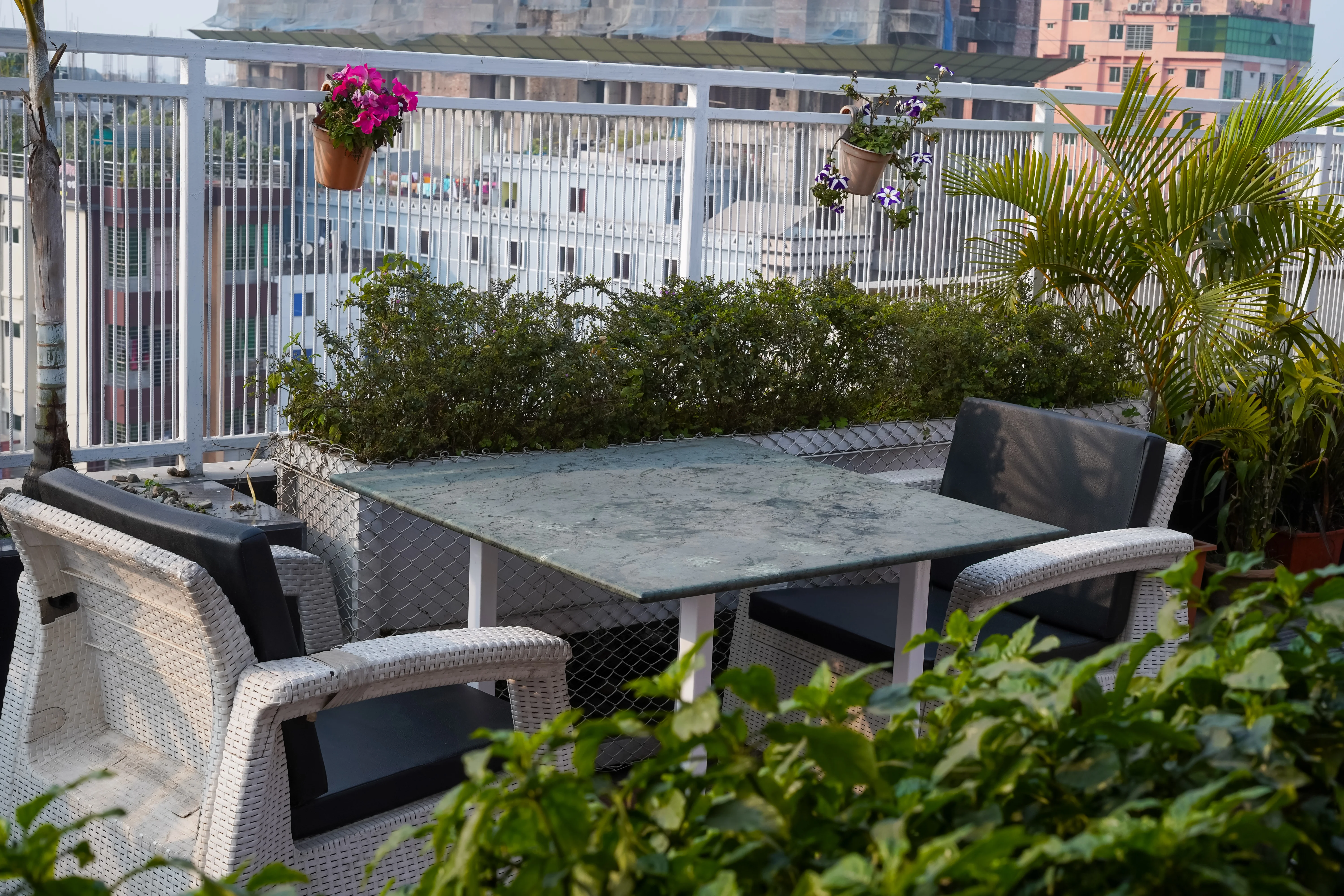 An aerial view of the Sky Lawn Hotel’s main entrance courtyard and multi-story facade showcases p...