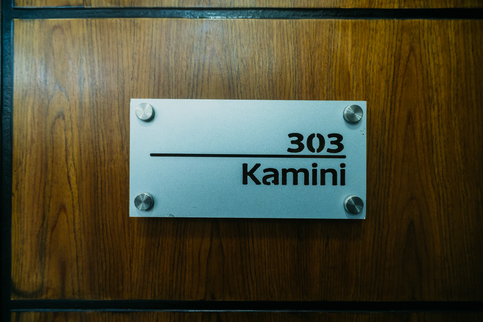 Sky Lawn Hotel guest room features a modern, elegantly designed space with a king-sized bed, tuft...