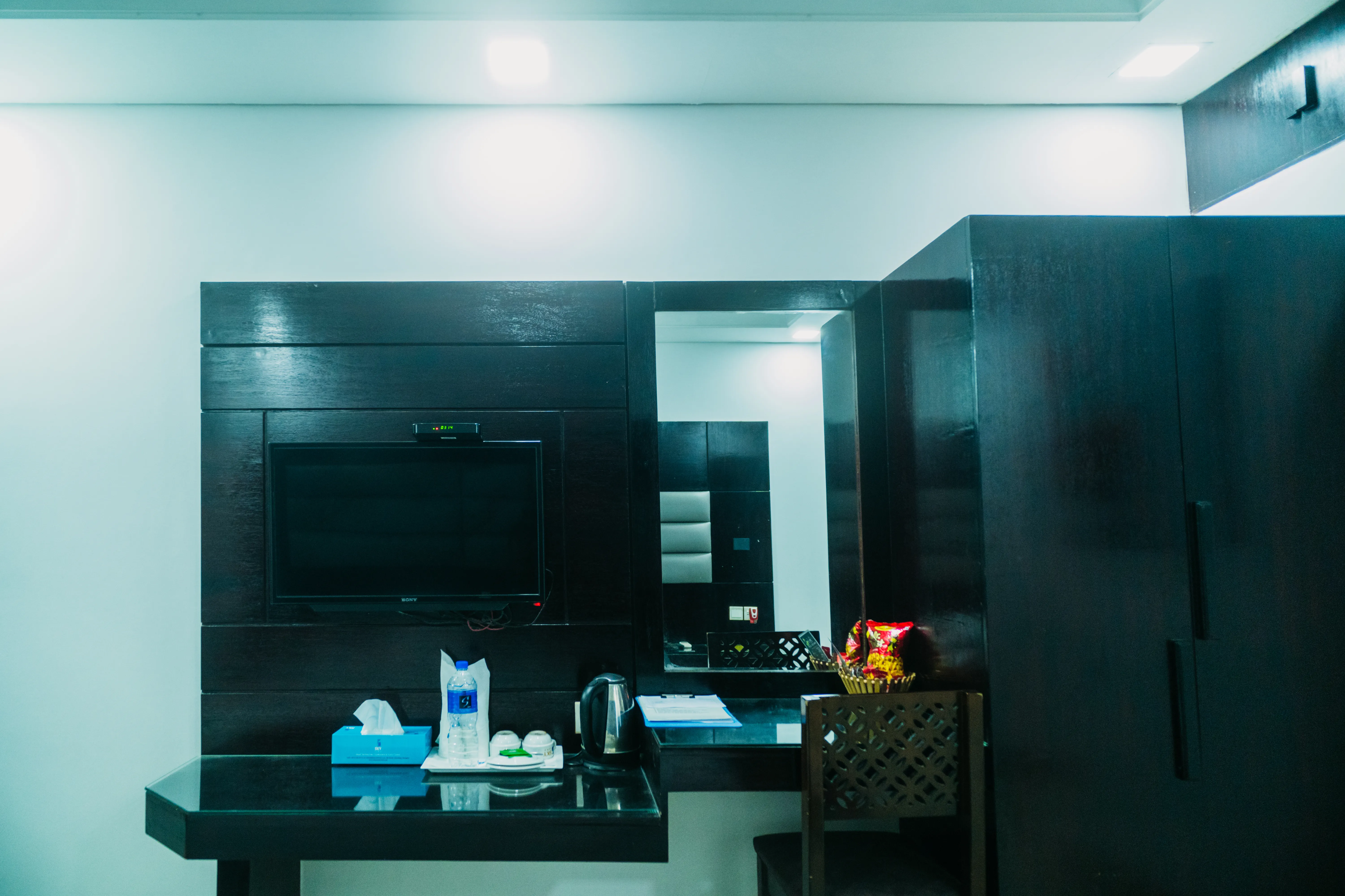 Sky Lawn Hotel’s guest room features a modern design with a distinctive circular ceiling motif (i...